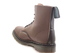 Workboot-shaped footwear with a brown top and a strong bouncing sole sewin-on.